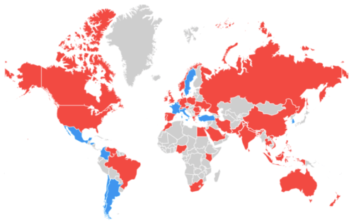 The image is a world map from Google Trends, with countries colored red where "website traffic" is searched more frequently and blue where "growth hacking" is more popular. Red dominates the map, indicating a higher search interest in website traffic globally.
